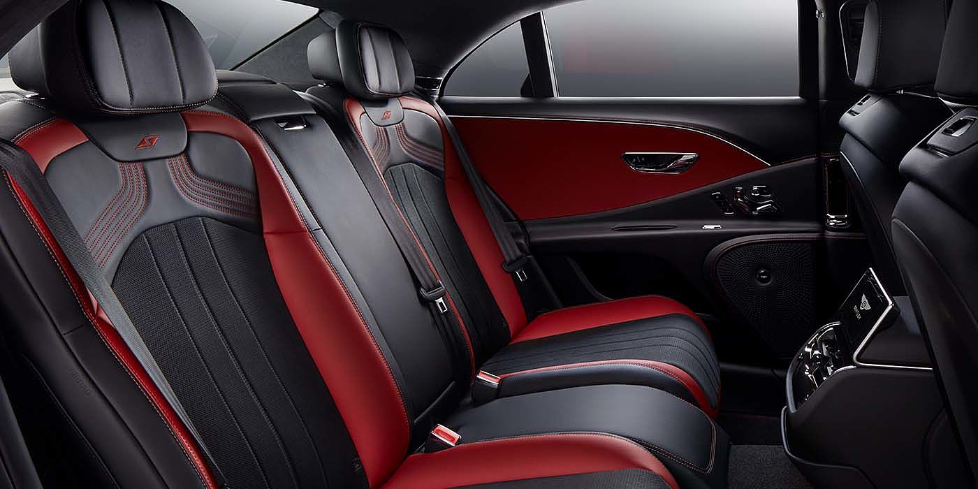 Bentley Praha Bentley Flying Spur S sedan rear interior in Beluga black and Hotspur red hide with S stitching
