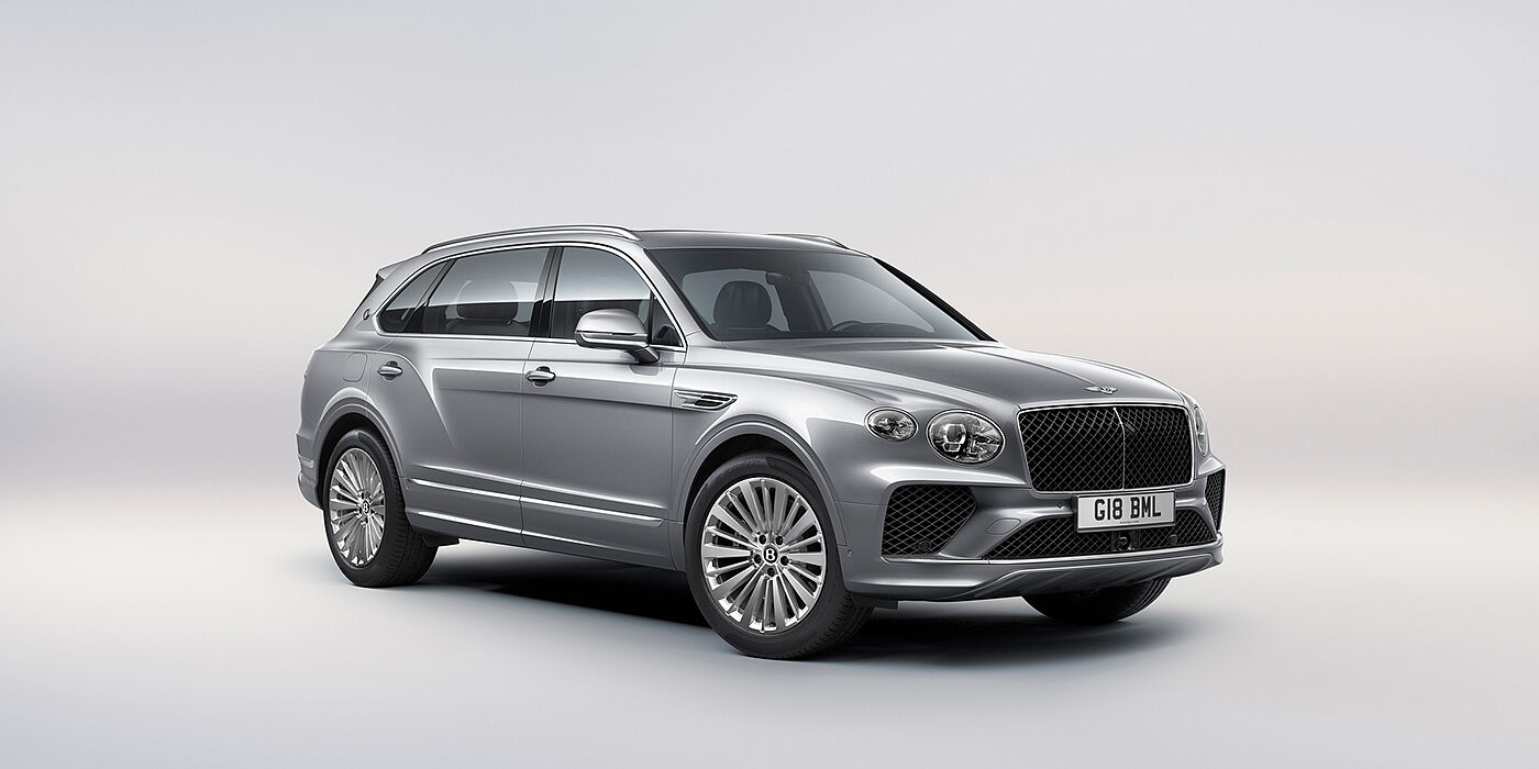 Bentley Praha Bentley Bentayga Extended Wheelbase luxury SUV front three quarter view in Moonbeam paint with 21 inch five spoke painted wheels