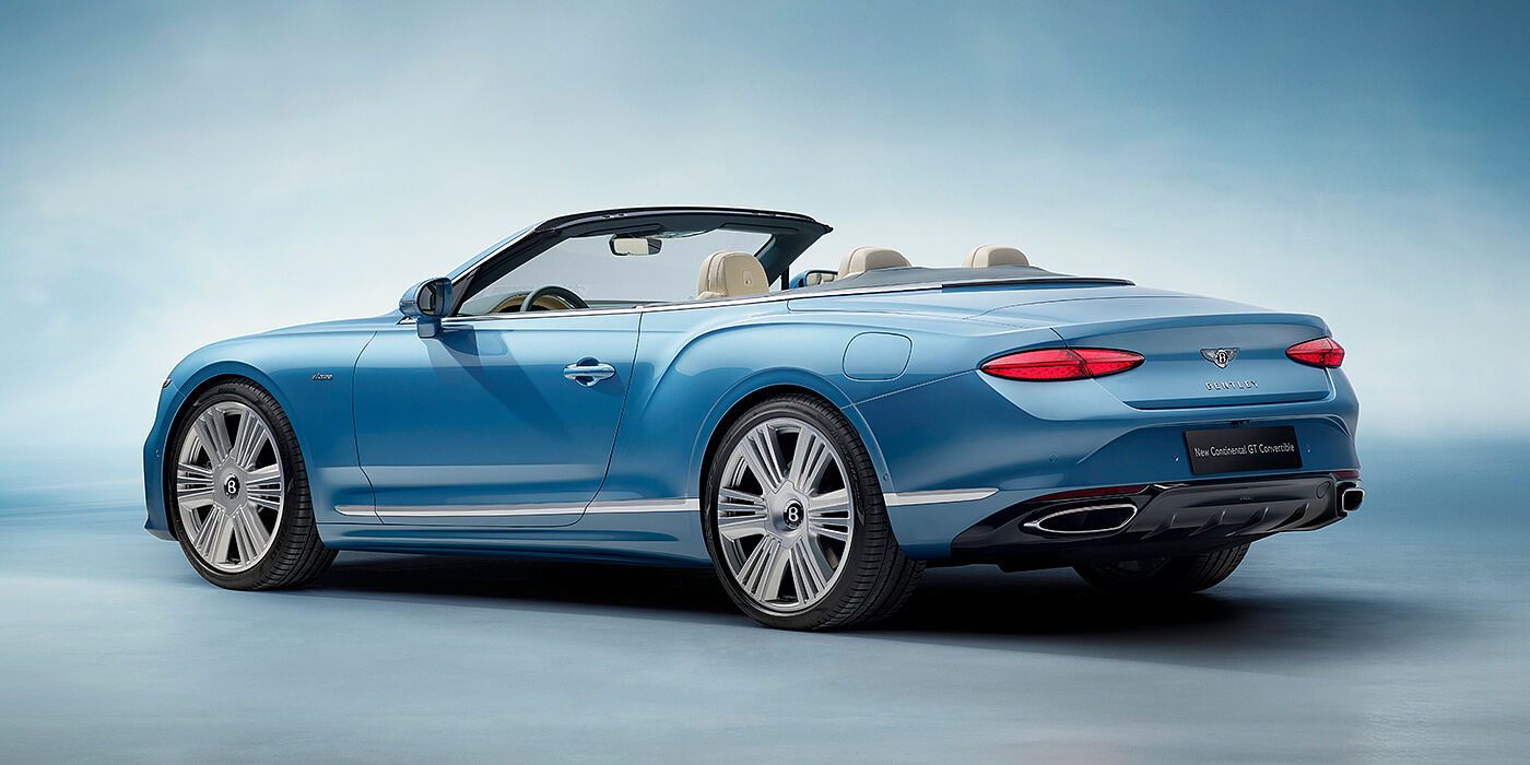 Bentley Praha New Bentley Continental GTC Azure convertible rear view in Light Windsor blue paint with 22 inch ten spoke wheels and chrome exterior details