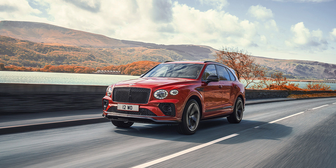 Bentley Praha Bentley Bentayga S SUV in Candy Red paint front 34 dynamic