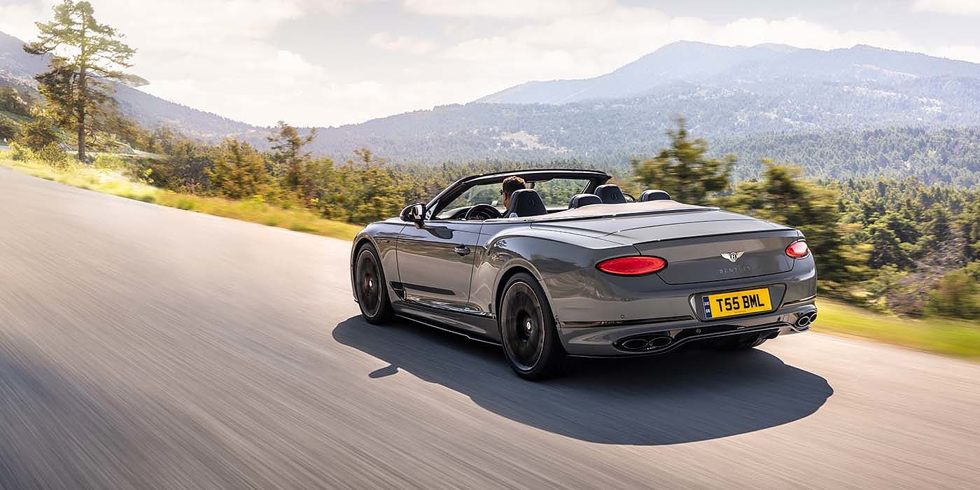 Bentley Praha Bentley Continental GTC S convertible in Cambrian Grey paint rear 34 dynamic driving