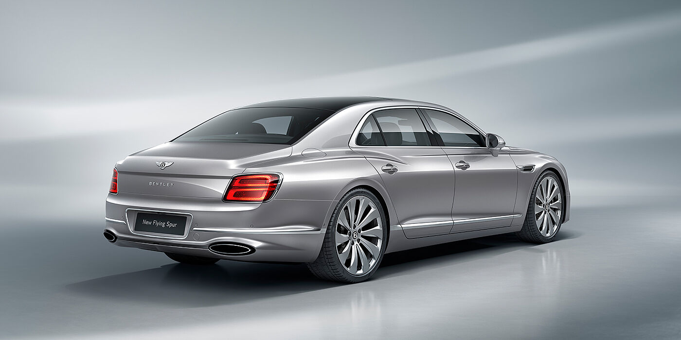 Bentley Praha New Bentley Flying Spur sedan rear view in Silverlake paint with ten spoke wheels and chrome matrix grille